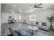 Open-concept living area with a dining space featuring modern light fixtures and furnishings at 346 W Edgemont Ave, Phoenix, AZ 85003