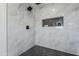 Beautiful marble walk-in shower with rain shower head and a tiled shelf at 346 W Edgemont Ave, Phoenix, AZ 85003