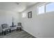 Bright sitting room with wood-look floors, two windows, and comfortable seating at 346 W Edgemont Ave, Phoenix, AZ 85003
