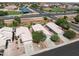 This aerial captures a neighborhood with lush greenery, well-maintained homes, and nearby schools and parks at 3534 N 106Th Ln, Avondale, AZ 85392