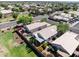 Aerial view of a home nestled in a community with well-manicured lawns and colorful landscaping at 3534 N 106Th Ln, Avondale, AZ 85392