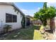 Landscaped backyard features lush lawn, shade trees, and covered patio, ideal for enjoying outdoor activities at 3534 N 106Th Ln, Avondale, AZ 85392
