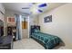 Charming bedroom with a baseball theme, featuring a blue ceiling fan and coordinated decor at 3534 N 106Th Ln, Avondale, AZ 85392