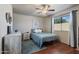 Cozy bedroom featuring hardwood floors, ceiling fan and a serene ambiance at 3534 N 106Th Ln, Avondale, AZ 85392