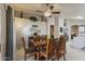 Inviting dining room featuring a stylish coffee bar, elegant table, and charming decor for memorable gatherings at 3534 N 106Th Ln, Avondale, AZ 85392