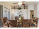 Comfortable dining room featuring a stylish coffee bar, elegant table, and charming decor for memorable gatherings at 3534 N 106Th Ln, Avondale, AZ 85392