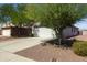 Single-story home features a spacious driveway, two-car garage, and desert landscaping at 3534 N 106Th Ln, Avondale, AZ 85392