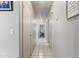 Bright hallway with tile flooring and access to multiple rooms in the home at 3534 N 106Th Ln, Avondale, AZ 85392