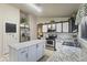 Charming kitchen featuring a island, stainless steel appliances, and sleek countertops at 3534 N 106Th Ln, Avondale, AZ 85392
