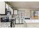 Kitchen showcasing sleek stainless steel appliances, island, and granite counters at 3534 N 106Th Ln, Avondale, AZ 85392