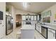 Stylish kitchen featuring stainless steel appliances, island, and sleek countertops at 3534 N 106Th Ln, Avondale, AZ 85392