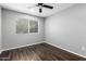 Bedroom featuring modern ceiling fan and window with blinds at 3810 N Maryvale Pkwy # 2020, Phoenix, AZ 85031