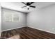 Bedroom with hardwood floors, a ceiling fan, and natural light at 3810 N Maryvale Pkwy # 2020, Phoenix, AZ 85031