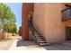 Exterior view of an apartment building featuring stairs leading to upper-level units at 3810 N Maryvale Pkwy # 2020, Phoenix, AZ 85031