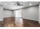 Bright living room with wood flooring, neutral walls, and sliding doors for natural light at 3810 N Maryvale Pkwy # 2020, Phoenix, AZ 85031