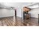 Hardwood floors throughout the kitchen and living room, with dark marbled countertops at 3810 N Maryvale Pkwy # 2020, Phoenix, AZ 85031