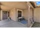 Inviting front porch with a seating area, a decorated door, and a charming ambiance at 4101 S Dewdrop Ct, Gilbert, AZ 85297