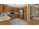 Well-lit kitchen featuring stainless steel appliances, granite countertops, and warm wood cabinetry at 4101 S Dewdrop Ct, Gilbert, AZ 85297