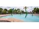 Inviting pool area with playful water features, surrounded by comfortable lounge chairs for relaxing summer days at 4101 S Dewdrop Ct, Gilbert, AZ 85297