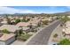 Aerial view of home on well-kept street with beautiful desert mountain backdrop at 4459 E Desert Wind Dr, Phoenix, AZ 85044