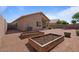 Spacious backyard with gravel landscaping and planter boxes at 4459 E Desert Wind Dr, Phoenix, AZ 85044