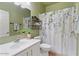 Stylish bathroom with floral shower curtain and modern fixtures at 4459 E Desert Wind Dr, Phoenix, AZ 85044