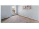 Bright bedroom with large window and neutral colored carpet at 4459 E Desert Wind Dr, Phoenix, AZ 85044
