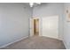 Spacious bedroom featuring vaulted ceiling, double closet, and neutral carpet at 4459 E Desert Wind Dr, Phoenix, AZ 85044