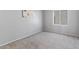 Cozy bedroom with neutral carpet, artwork, and bright window at 4459 E Desert Wind Dr, Phoenix, AZ 85044