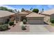 Charming home with well-maintained landscaping, desert flora, and tile roof at 4459 E Desert Wind Dr, Phoenix, AZ 85044