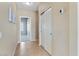 Inviting hallway with tile flooring and access to multiple rooms at 4459 E Desert Wind Dr, Phoenix, AZ 85044