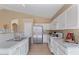 Well-appointed kitchen with ample counter space, stainless steel appliances, and a convenient breakfast bar area at 4459 E Desert Wind Dr, Phoenix, AZ 85044