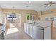Bright kitchen featuring stainless steel appliances, tile floors, and a sunny breakfast nook at 4459 E Desert Wind Dr, Phoenix, AZ 85044