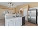 Well-lit kitchen with stainless steel appliances, tile flooring, and an open layout at 4459 E Desert Wind Dr, Phoenix, AZ 85044