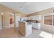 Bright kitchen with white cabinetry, a breakfast bar, and modern appliances creating a functional and stylish space at 4459 E Desert Wind Dr, Phoenix, AZ 85044