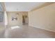 Open-concept living room with tile flooring, and neutral paint at 4459 E Desert Wind Dr, Phoenix, AZ 85044