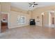 Spacious living room with tile flooring, high ceilings, and neutral paint tones at 4459 E Desert Wind Dr, Phoenix, AZ 85044