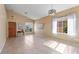Bright, spacious living room with tile flooring and plenty of natural light from large windows at 4459 E Desert Wind Dr, Phoenix, AZ 85044