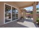 Relaxing covered patio featuring outdoor seating area and ceiling fan at 4459 E Desert Wind Dr, Phoenix, AZ 85044