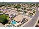 Expansive aerial view of a neighborhood highlighting a home with a private pool and solar panels at 509 W Villa Rita Dr, Phoenix, AZ 85023