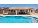 Stunning aerial view of a backyard featuring a sparkling pool and covered patio for outdoor gatherings at 509 W Villa Rita Dr, Phoenix, AZ 85023