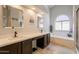 Bathroom with double sinks, soaking tub, and elegant mirrors at 509 W Villa Rita Dr, Phoenix, AZ 85023