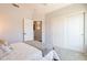 Bright carpeted bedroom with closet and adjoining bathroom access. Ceiling fan and natural light provided at 509 W Villa Rita Dr, Phoenix, AZ 85023