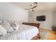 Comfortable bedroom with wood frame bed, and ceiling fan at 509 W Villa Rita Dr, Phoenix, AZ 85023
