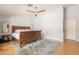 Bedroom with wood floors, ceiling fan and large area rug at 509 W Villa Rita Dr, Phoenix, AZ 85023