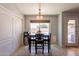 Bright dining area with tile floors, backyard views, and adjacent storage space at 509 W Villa Rita Dr, Phoenix, AZ 85023