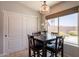 Charming breakfast nook with table set, storage, and backyard views at 509 W Villa Rita Dr, Phoenix, AZ 85023