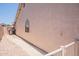 Side view of home with covered walkway and minimal landscaping at 509 W Villa Rita Dr, Phoenix, AZ 85023