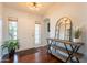Entryway featuring hardwood floors, natural light, and stylish console table at 509 W Villa Rita Dr, Phoenix, AZ 85023
