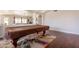 Game room featuring a covered pool table, hardwood floors, and adjacent living spaces at 509 W Villa Rita Dr, Phoenix, AZ 85023